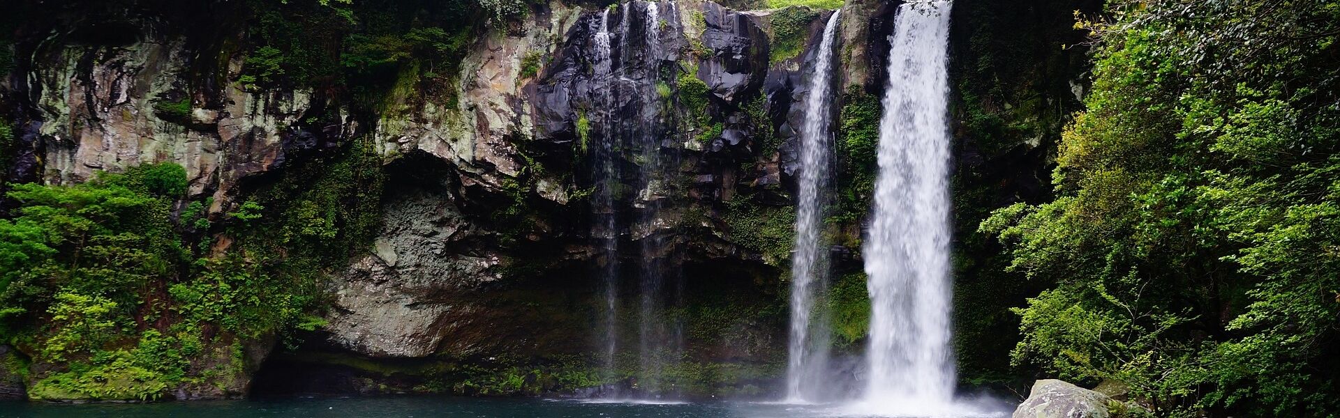 Panoramic view of Phnom Kulen’s waterfalls for a scenic Phnom Kulen Tours banner by Legend Travel Group.
